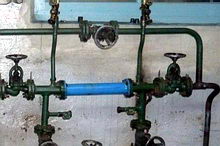 burning watered mazout mixed with port bilge water without failure of the flame. Recycling oiled water.